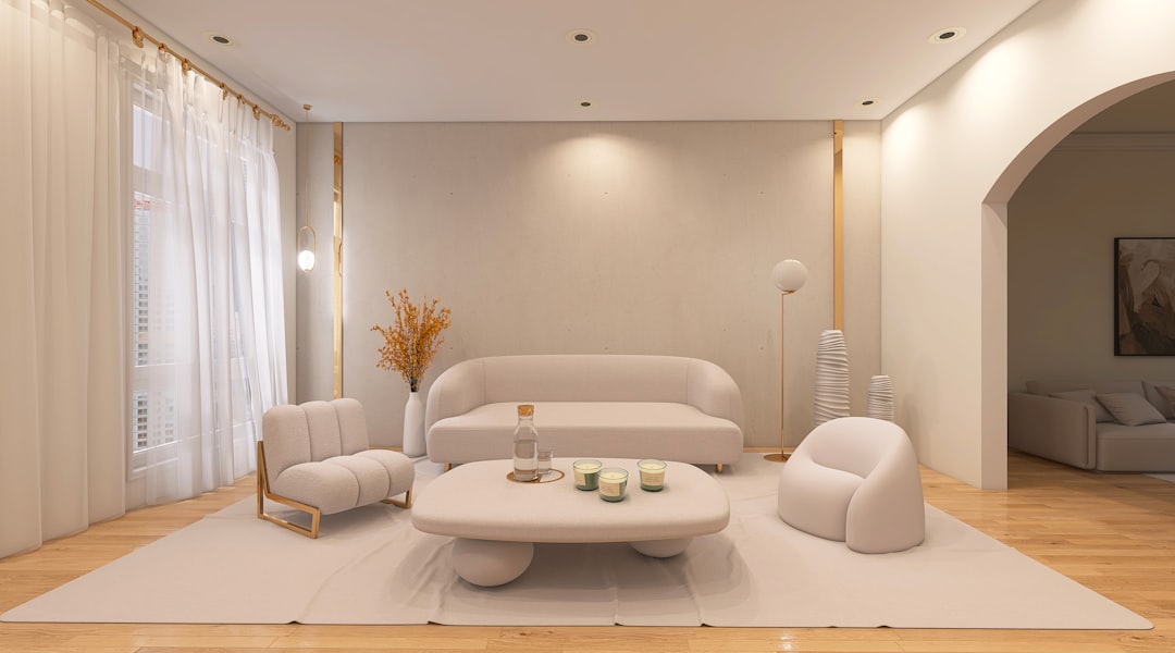 A bright and airy modern luxury living room with minimalist furniture, high ceilings, and large windows showcasing professional interior architecture.