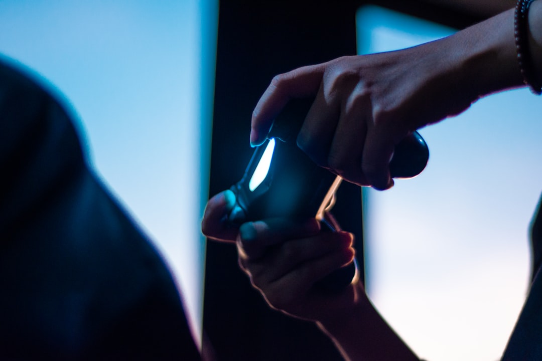 A professional close-up of one person's hands giving house keys to another, representing a successful real estate transaction and closing.