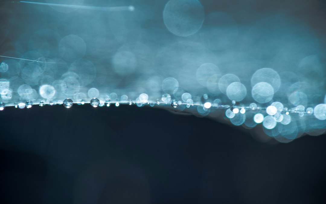 An abstract visualization of interconnected glowing blue nodes and lines, representing complex data science techniques and network analysis on a dark background.